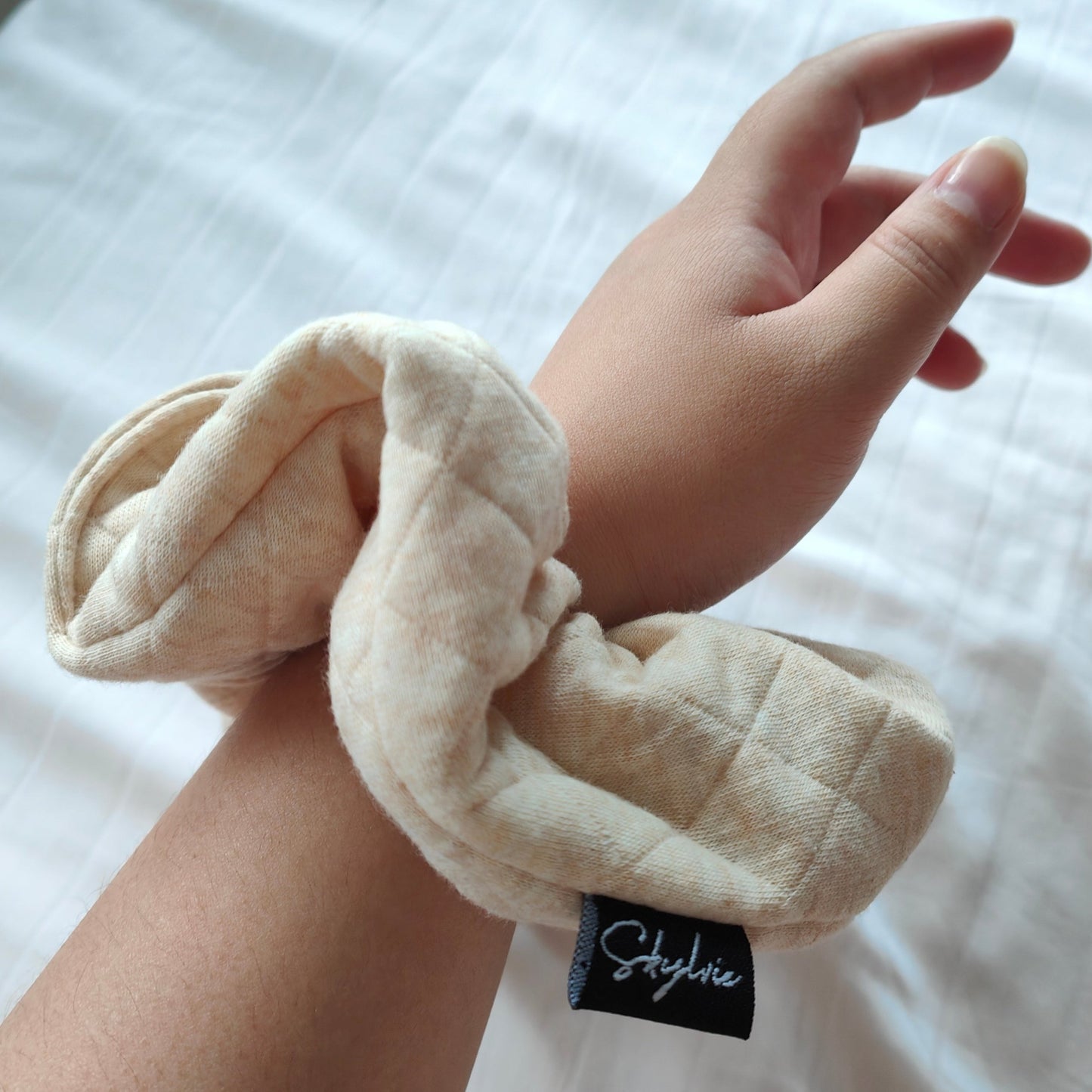 Eve scrunchie around wrist