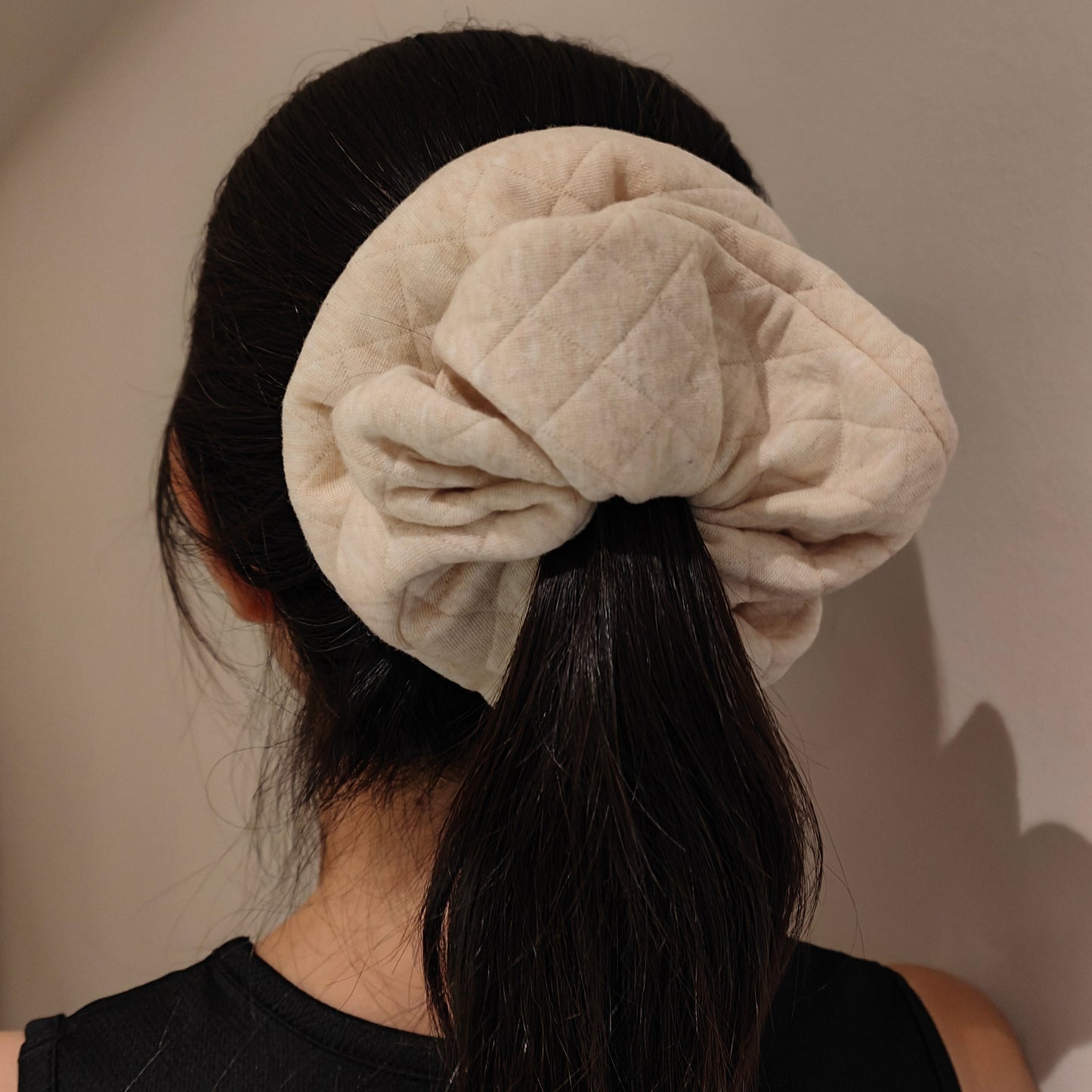 Eve scrunchie tied around hair