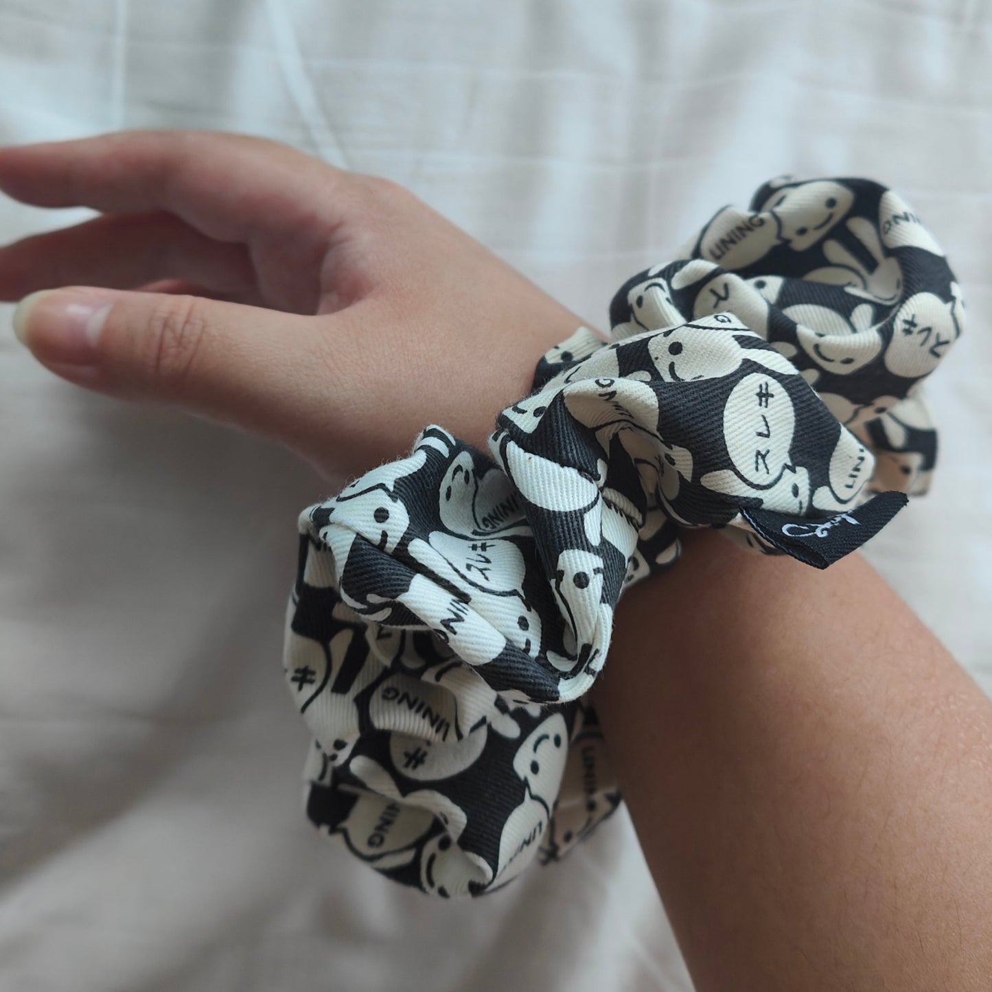 Mia scrunchie worn around wrist
