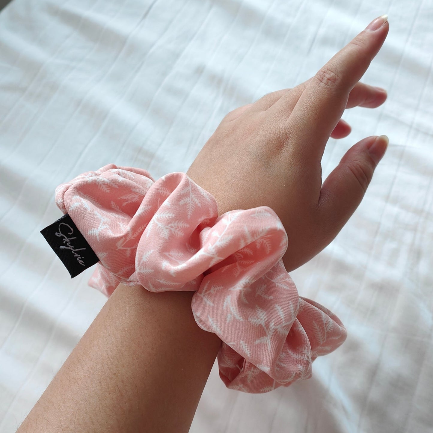 Sheryl scrunchie around wrist