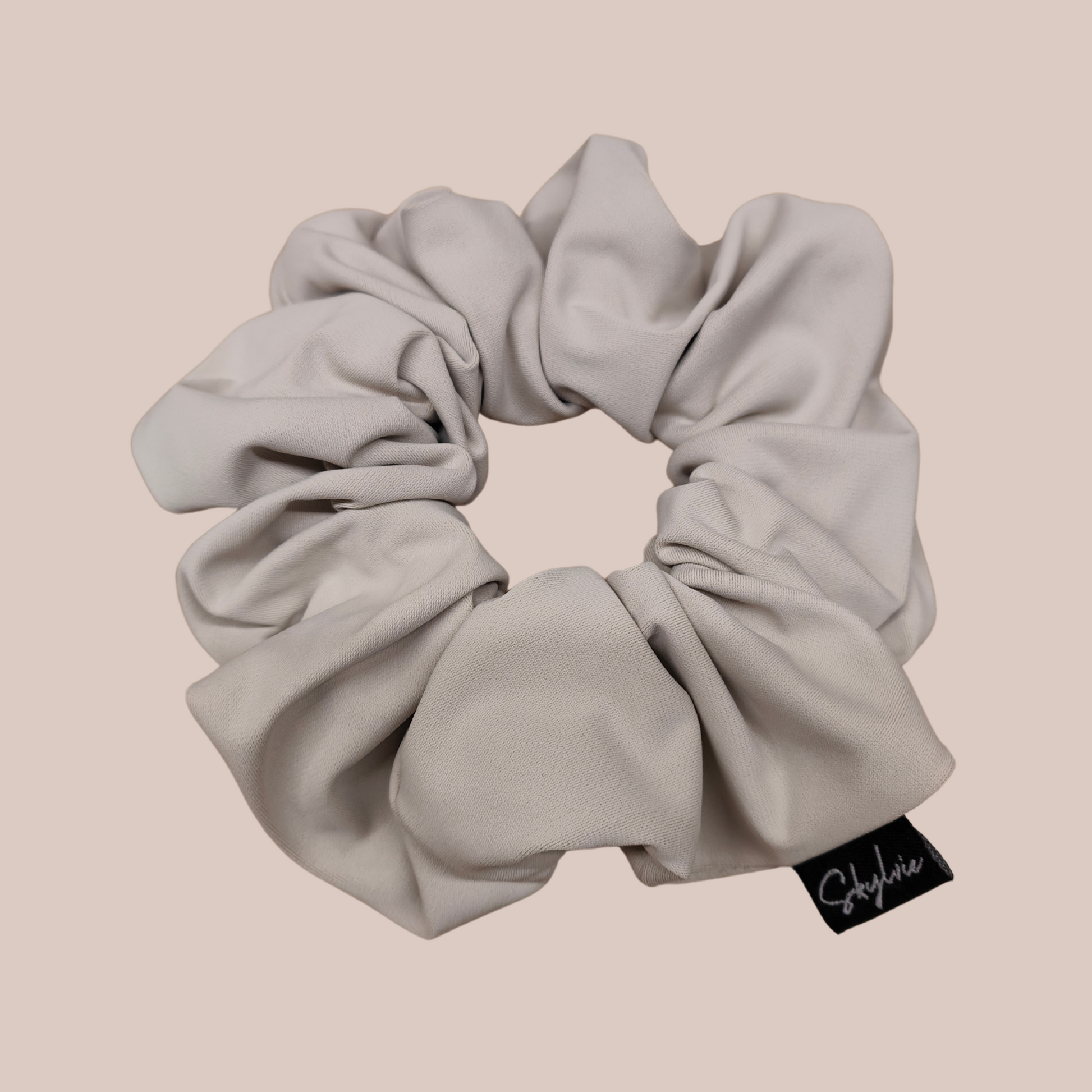 Angela sports scrunchie, made of a quick drying fabric with 90% UV Protection